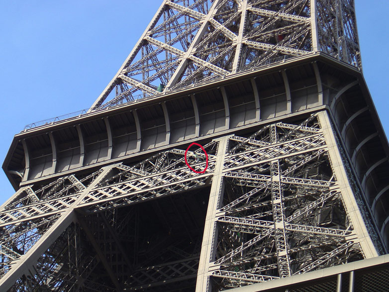 Mike Robertson climbing the Eiffel tower as a protest against the Burma Regime