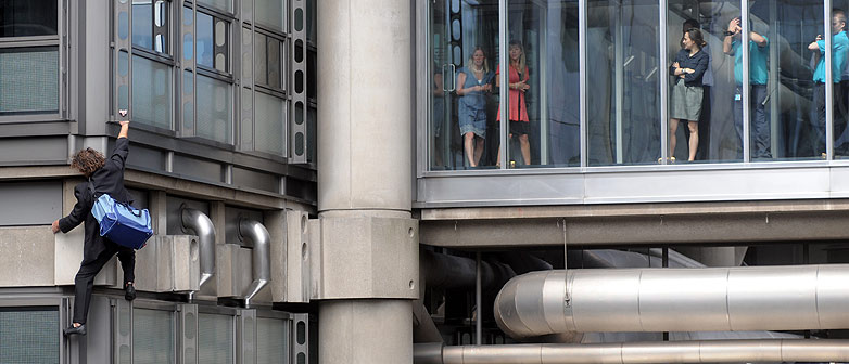 Mike Robertson scales the Lloyds building in London as a protest against the financial interests that Lloyds holds with the  Burma Regime.